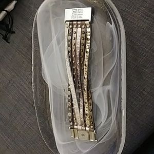 Multi strand leather metal and rhinestone bracelet